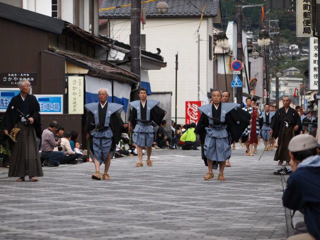 a festival near enoshima with elderly Japanese male participants